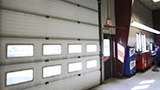 Garage doors on new J & R Auto service repair shop building